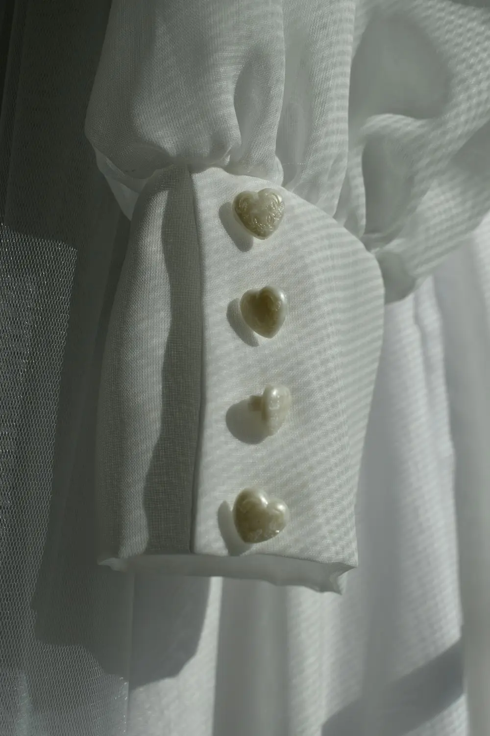 Detail kancing di lengan gamis
